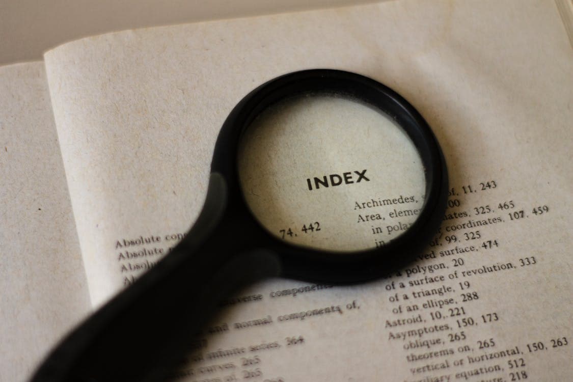 Magnifying glass on a book page – nothing overlooked